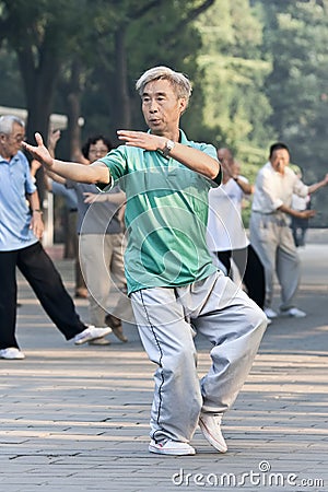 Group practice Tai Chi in Ritan Park, Beijing, China Editorial Stock Photo